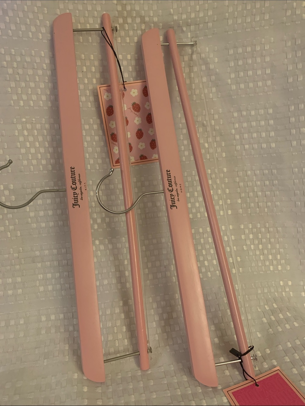 Juicy Couture pink wooden hangers, set of two, 15.5 inches long. New.